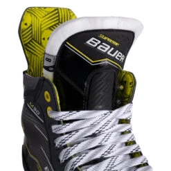 Bauer Supreme M30 Hockey Skates - Intermediate (2024) -Hockeyvancouver Bauer Hockey Skates Bauer Supreme M30 Intermediate 2024 Black Yellow close up of tongue and laces facing right